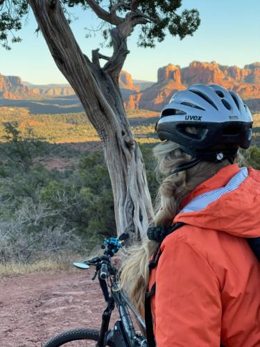 a person wearing a helmet standing next to a bike at Sedona Room Homestay - Thunder Mountain in Sedona