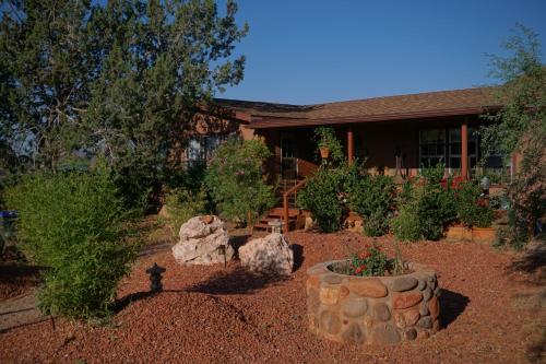 a garden in front of a house at Sedona Room Homestay - Thunder Mountain in Sedona
