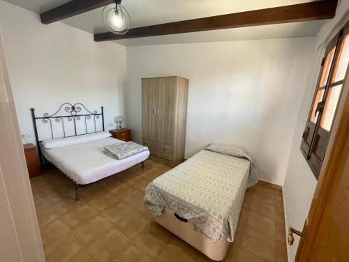 Ein Bett oder Betten in einem Zimmer der Unterkunft Casita playa