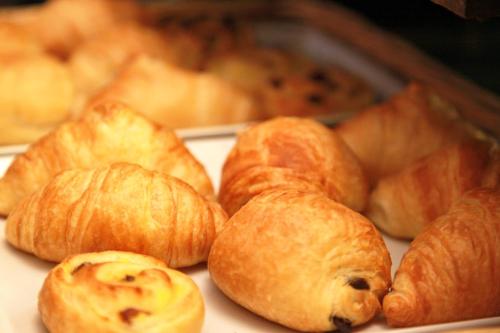 a bunch of croissants sitting on a table at Les Arcades Le Lion D'or in Buis-les-Baronnies