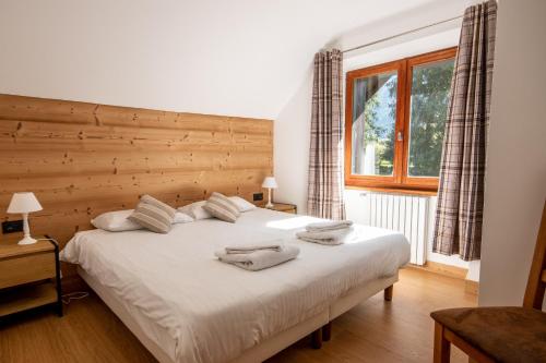 Tempat tidur dalam kamar di Chalet des Lacs - Chamonix
