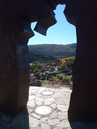 a view from a hole in a building with a view at El Collado 17 in Soria