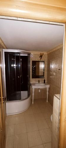 a bathroom with a sink and a mirror at Medieval Apartment in Sighişoara