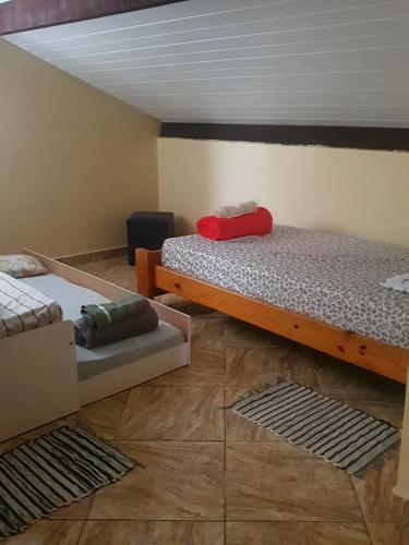 a bedroom with two beds in a room at Apartamento Vista da Montanha in Nova Friburgo