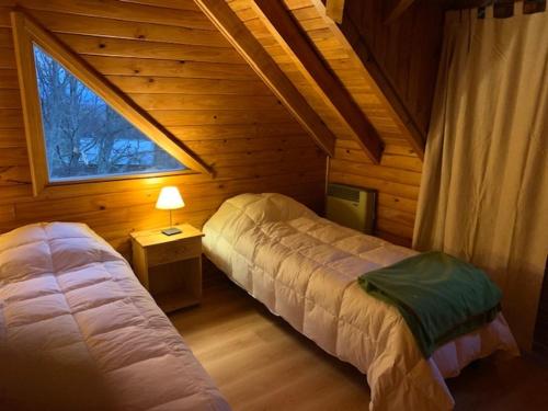 Voodi või voodid majutusasutuse Casa Lago Hermoso toas