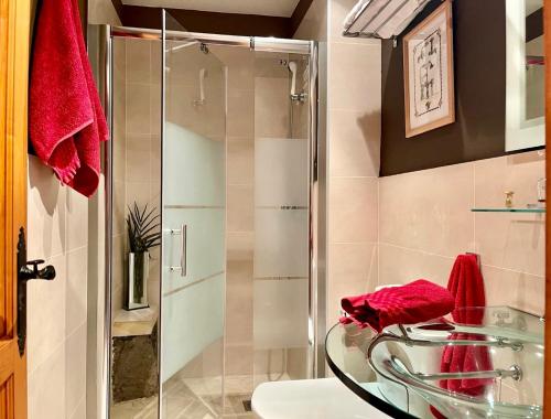 a bathroom with a glass sink and a shower at casa rural LA LIMERA con piscina privada in Santa Lucía