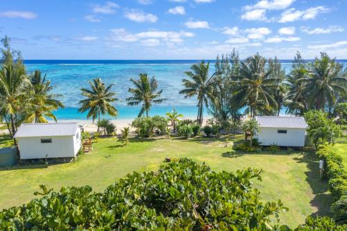 an aerial view of a resort with the ocean in the background at Tai Marino Beach Bungalows in Amuri