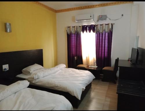 Cama o camas de una habitación en Hotel Joshi