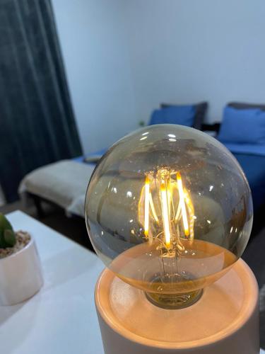 two candles in a glass bowl on a table at Stari Zaječar apartments in Zaječar