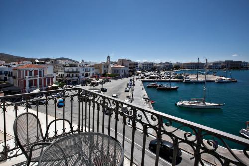 a view of a harbor with boats in the water at Aegli 1876 in Tinos Town