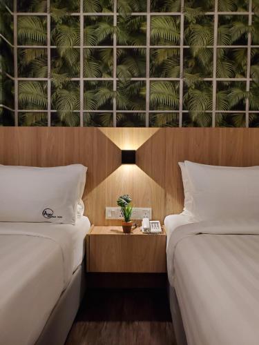 เตียงในห้องที่ Apex Boutique Hotel @ Bandar Sunway