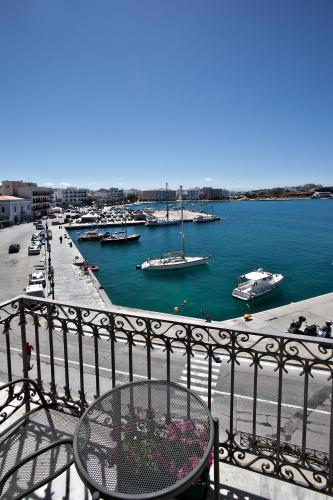 a view of a harbor with boats in the water at Aegli 1876 in Tinos Town