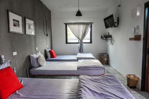 Postel nebo postele na pokoji v ubytování Patoey House