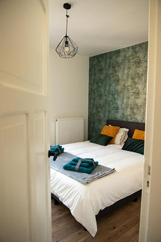 Postel nebo postele na pokoji v ubytování Vakantiewoning Dorp-28