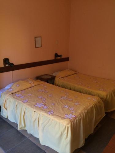 A bed or beds in a room at Hostal Santa Catalina