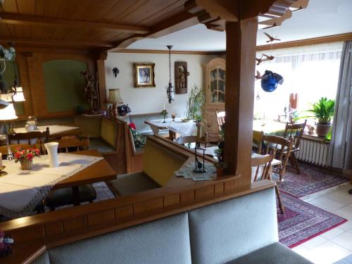 an overhead view of a restaurant with tables and chairs at Aussichtsbauernhofpension Hof Gretchens in Winterberg