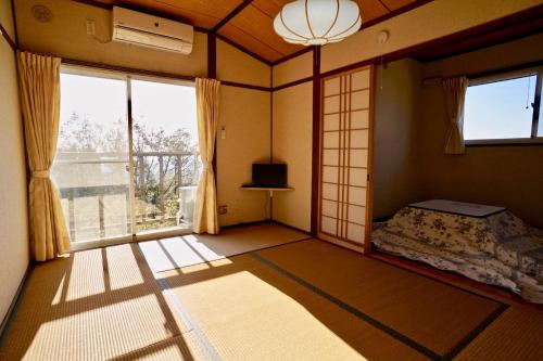 เตียงในห้องที่ Healing space tajima Shinmoe