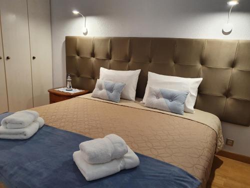 En eller flere senger på et rom på Apartamentos Navio Azul
