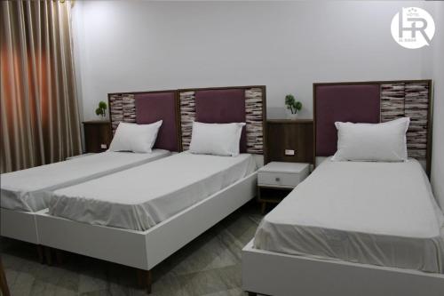 Hotel al rayanにあるベッド