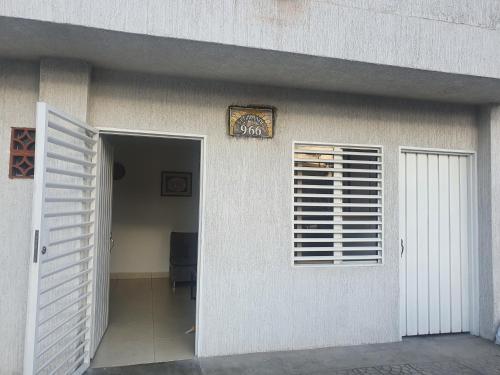 a door to a house with a window and a doorway at Buga Apartamento in Buga