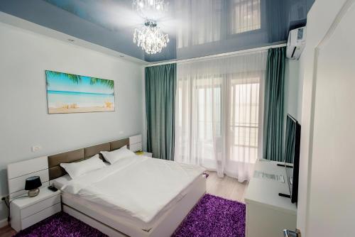 Katil atau katil-katil dalam bilik di Lamera Residence Mamaia Apartments