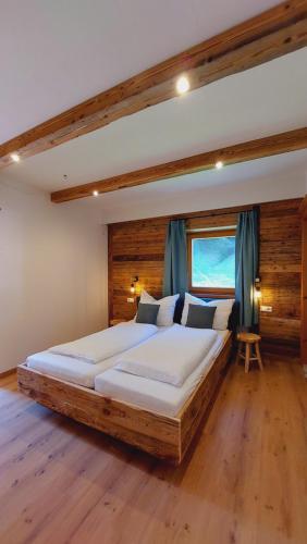 Postel nebo postele na pokoji v ubytování Alpenchalet Almrose