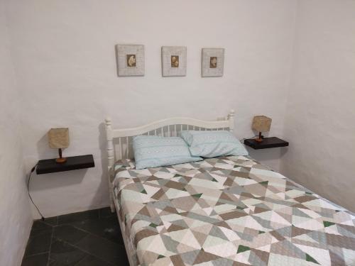 Postel nebo postele na pokoji v ubytování Casa aconchegante em Guaeca - 8 pessoas