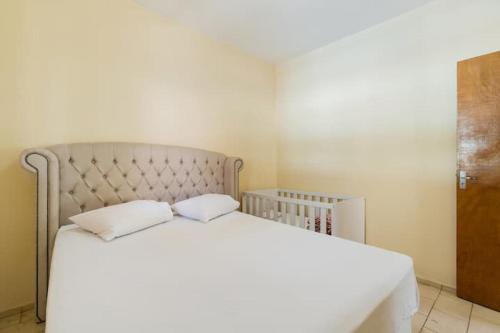 Ένα ή περισσότερα κρεβάτια σε δωμάτιο στο Espaço Barão - Área de Lazer