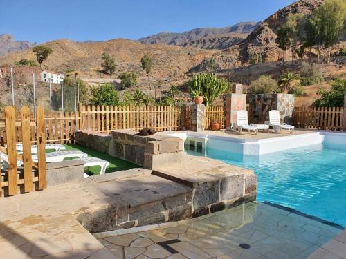 The swimming pool at or close to casa rural LA LIMERA con piscina privada
