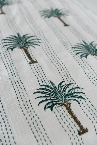 a drawing of palm trees on a white curtain at Royal Boutique Hotel in Cape Town