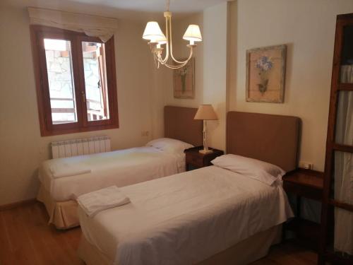Postel nebo postele na pokoji v ubytování Apartamento Sarrato IV de Sallent