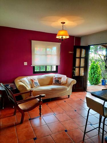 a living room with a couch and a table at Cabañas San Miguel in Alto Boquete
