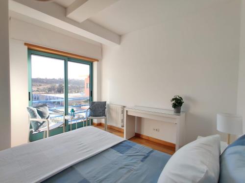 A bed or beds in a room at Albufeira Marina Views