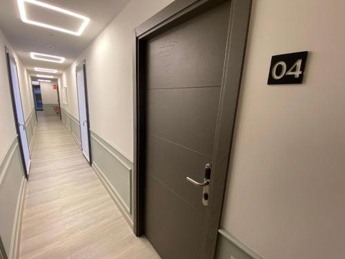 an office door with the number on it at Hotel Lusitania, Centro Ciudad, Parking Privado in Merida