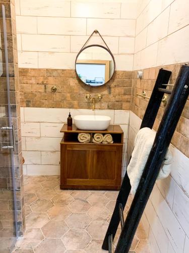 a bathroom with a sink and a mirror at Tři okna do hor-Celý byt k pronájmu in Rýmařov