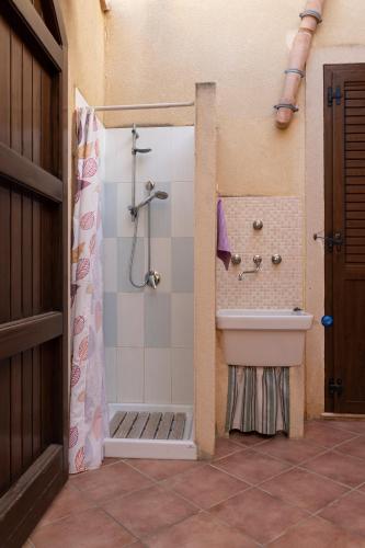 a bathroom with a shower and a sink at La Palma in San Vito lo Capo