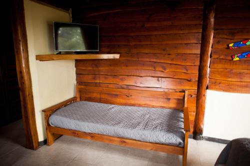 A bed or beds in a room at Cabaña Bariloche