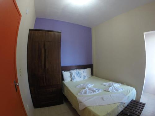 Katil atau katil-katil dalam bilik di Apartamentos da Coló