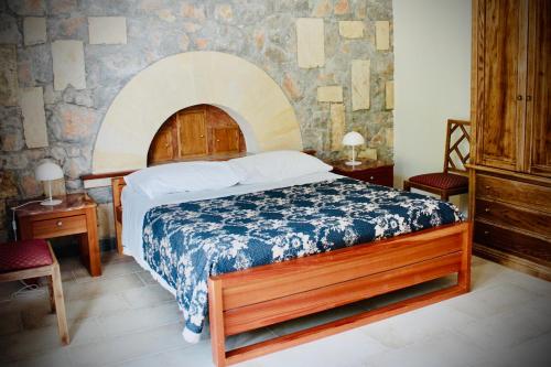 Postel nebo postele na pokoji v ubytování AL TEMPIO DELLA PACE