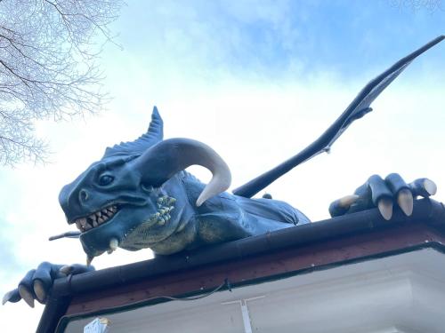a statue of a dragon on top of a building at Excalibur miniHotel in Eger