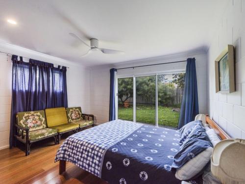 a bedroom with a bed and a window at BellaLuka in Iluka