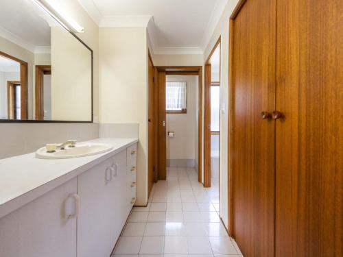 a bathroom with a sink and a mirror at Crowes Nest in Iluka