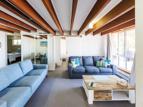 
a living room filled with furniture and a couch at The Net Shed in Iluka
