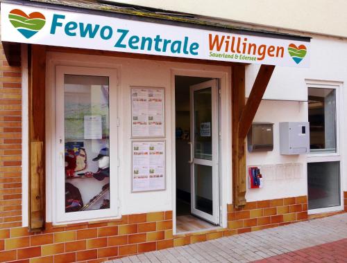 a building with a sign that reads fever two kentitle willuminati at Appartement Gänseblümchen in Willingen