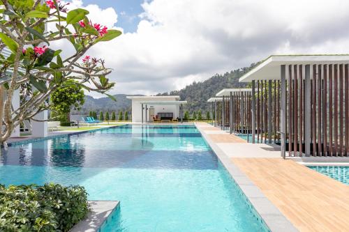 an image of a swimming pool at a resort at Genting Premium Suite Windmill Upon Hills by JAz Home Suites in Genting Highlands