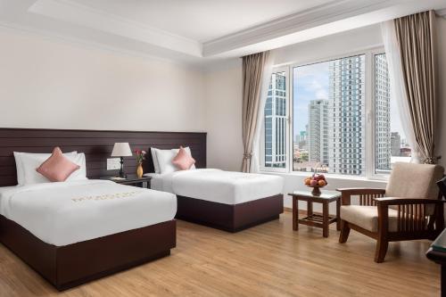 Ένα ή περισσότερα κρεβάτια σε δωμάτιο στο Duong Chan Hotel