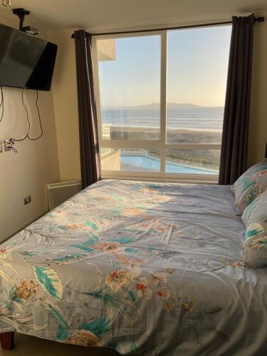 Ένα ή περισσότερα κρεβάτια σε δωμάτιο στο Laguna del mar La Serena