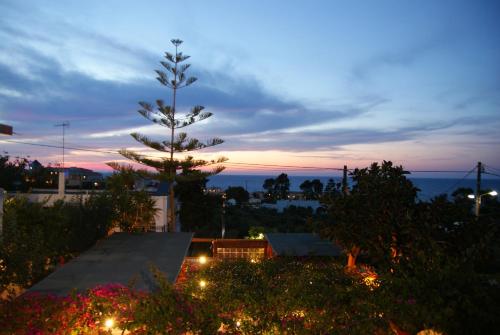 a view of the sunset from the roof of a house at Kastro Apartments in Panormos Rethymno