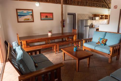 a living room with a couch and a table at Morrumbene Beach Resort in Morrumbene