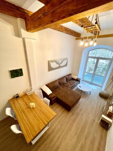 a living room with a couch and a table at Angel Apartment Černý důl in Cerny Dul